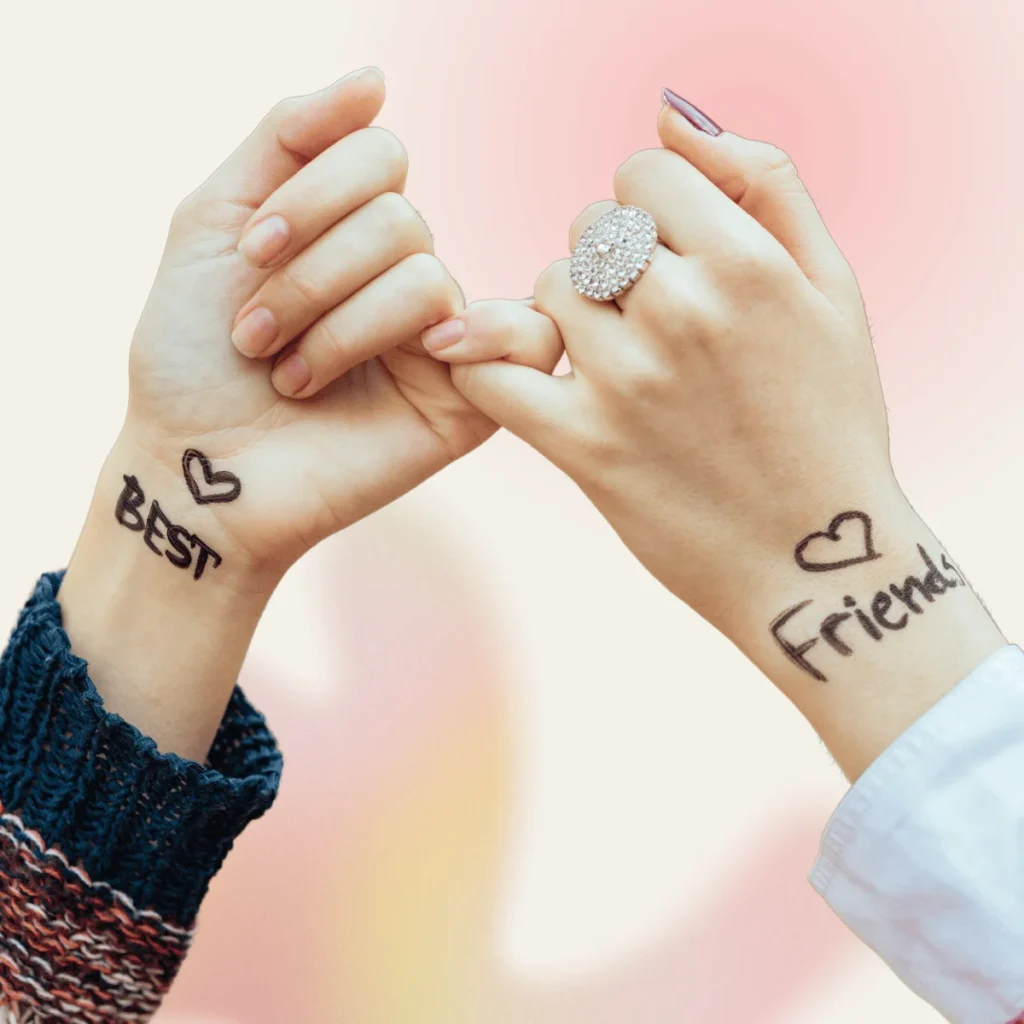 Two hands attached by the smallest finger with the sign best friends on both wrists. Positive Affirmations For Friendships