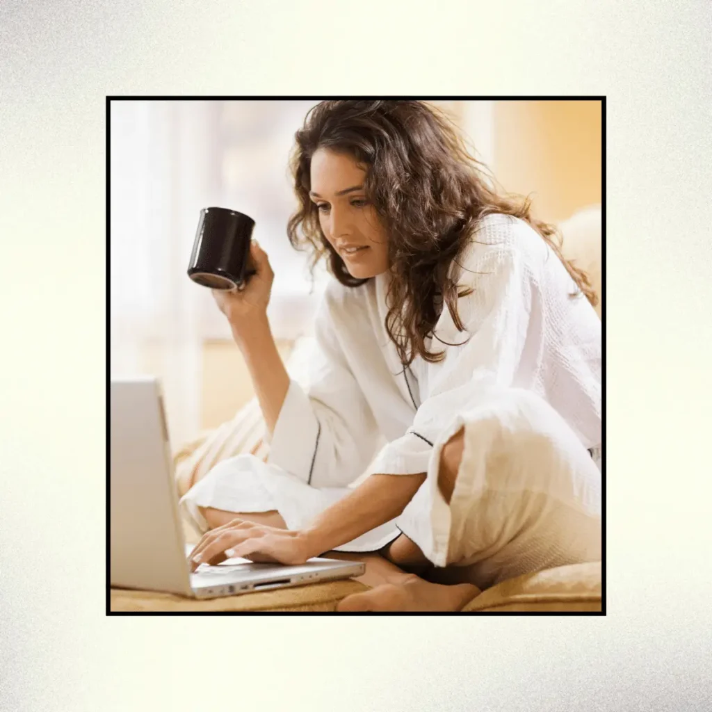 Woman working at home with laptop computer. Scripting Manifestation Technique