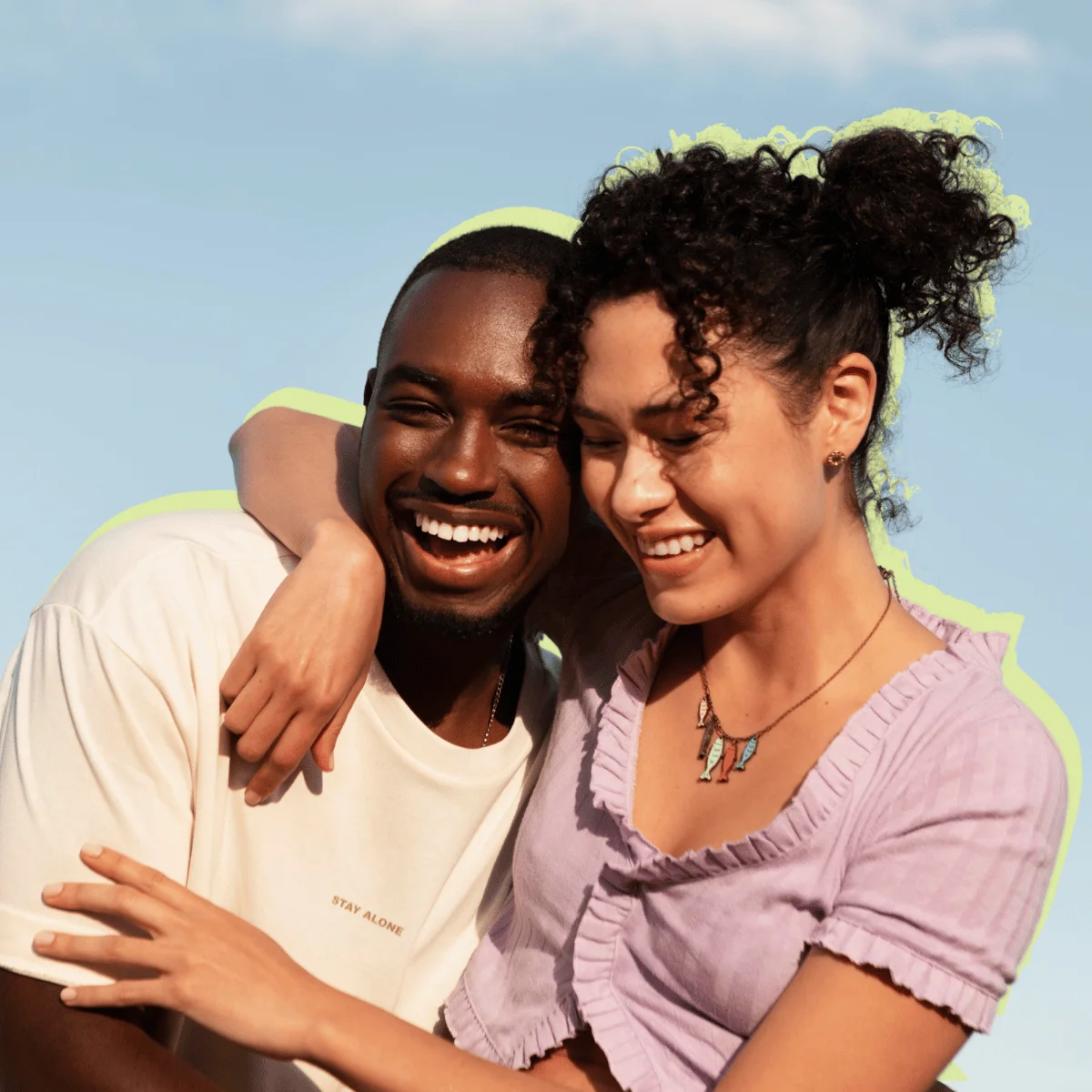 Young couple hugging outside on a warm day