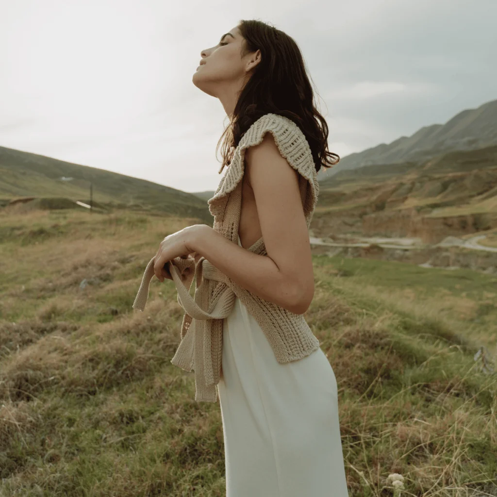 A Woman Standing on the Grass Field. Positive Affirmations For Self-Confidence