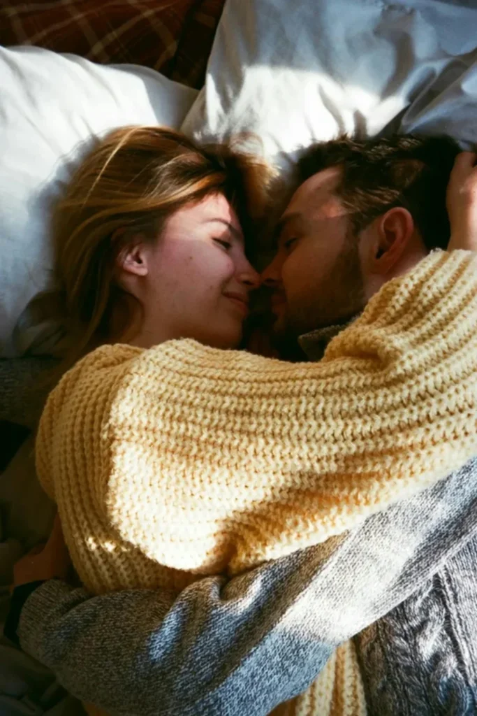 A young couple hugging in bed. Journaling Prompts for Couples