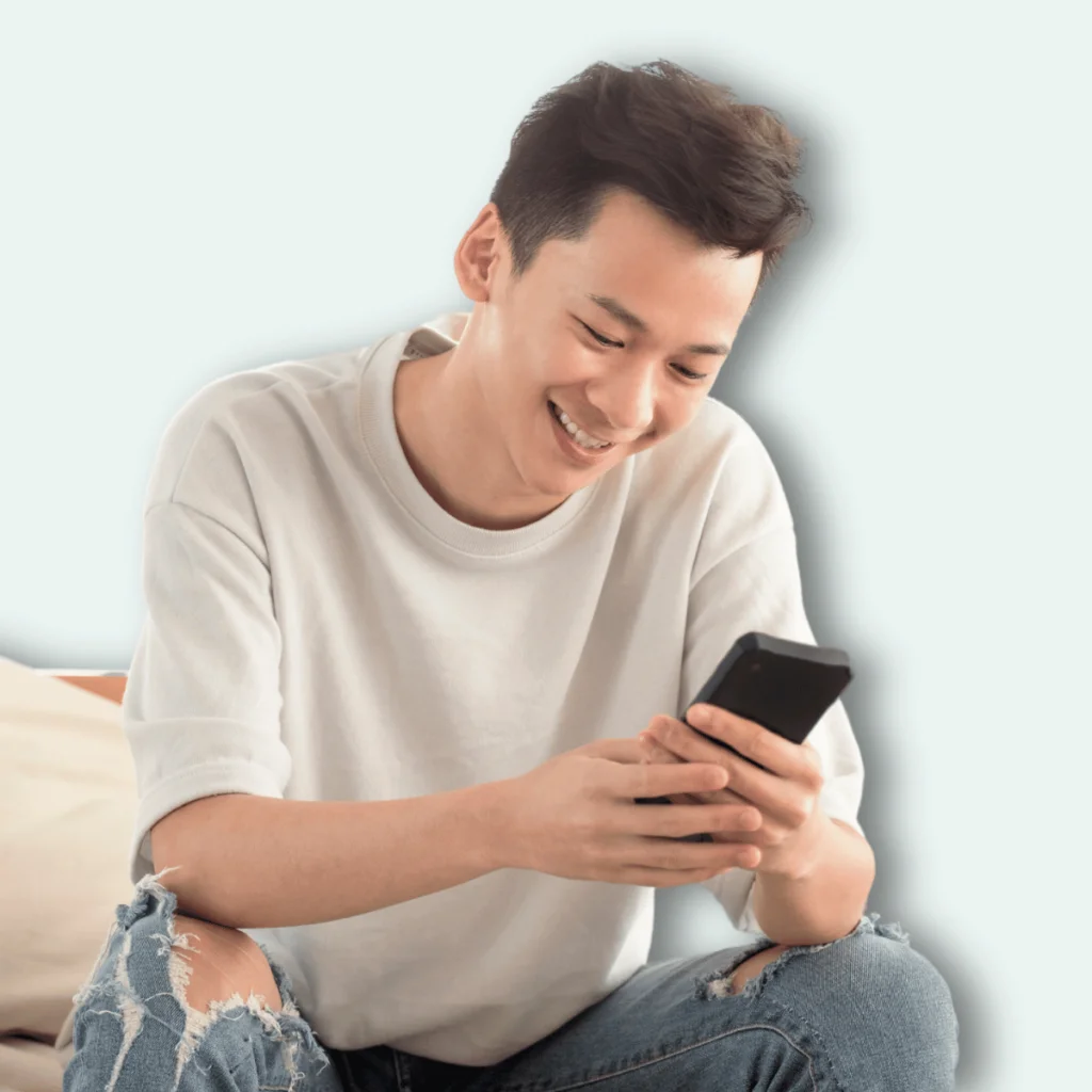 Man smiling-at-his-phone.-Good-Morning-and-Love-Quotes