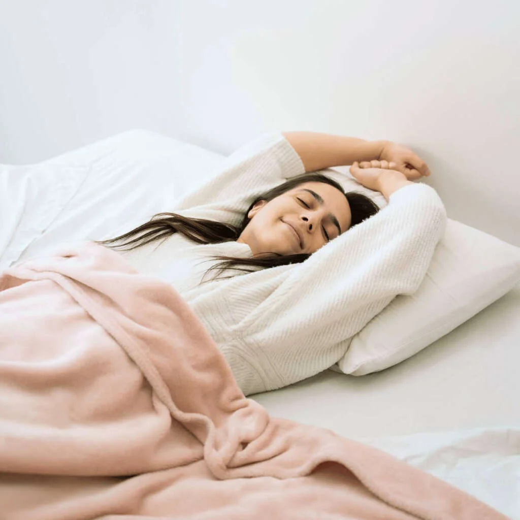 Medium shot woman laying in bed