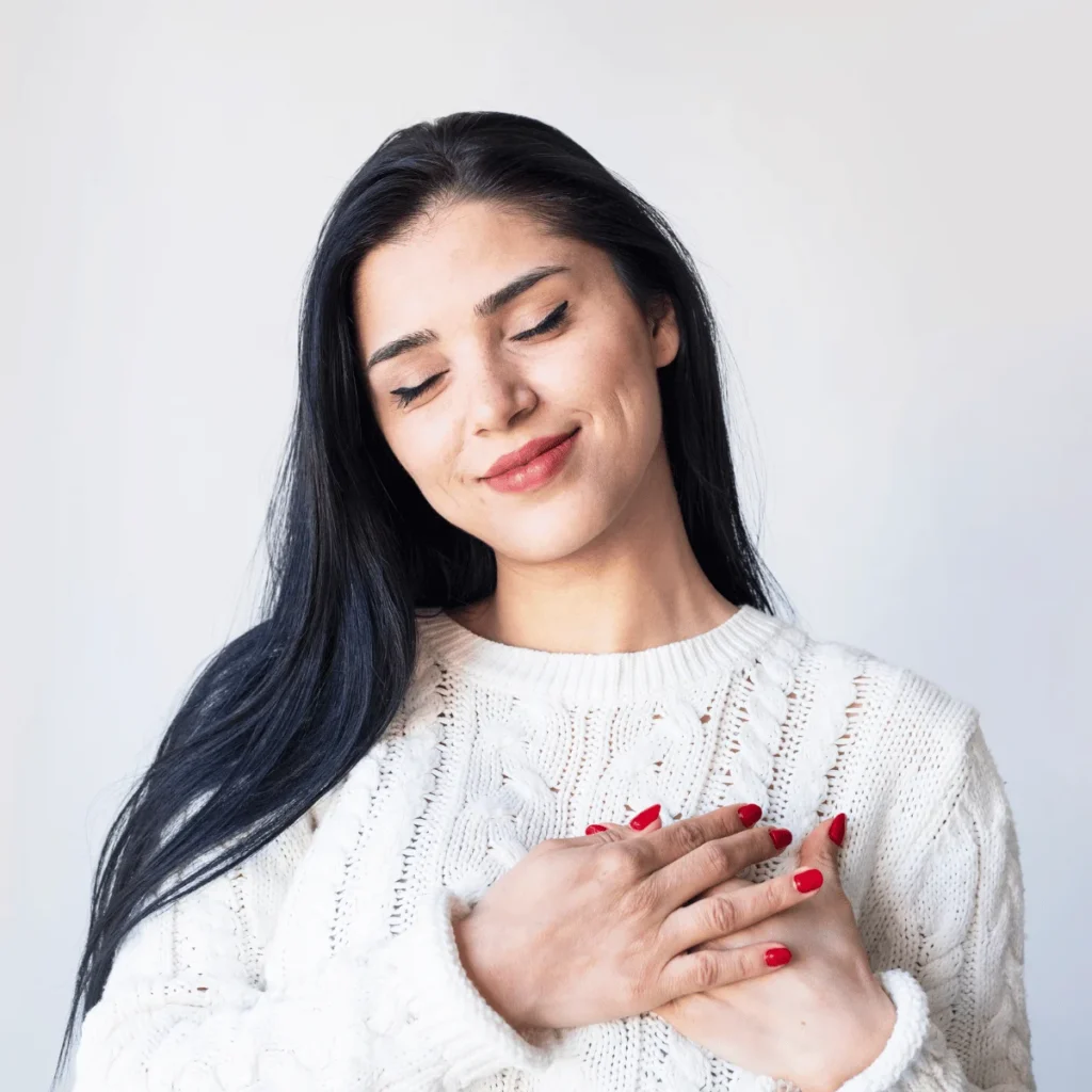 Self+love, self acceptance, happiness concept. Woman hugging herself