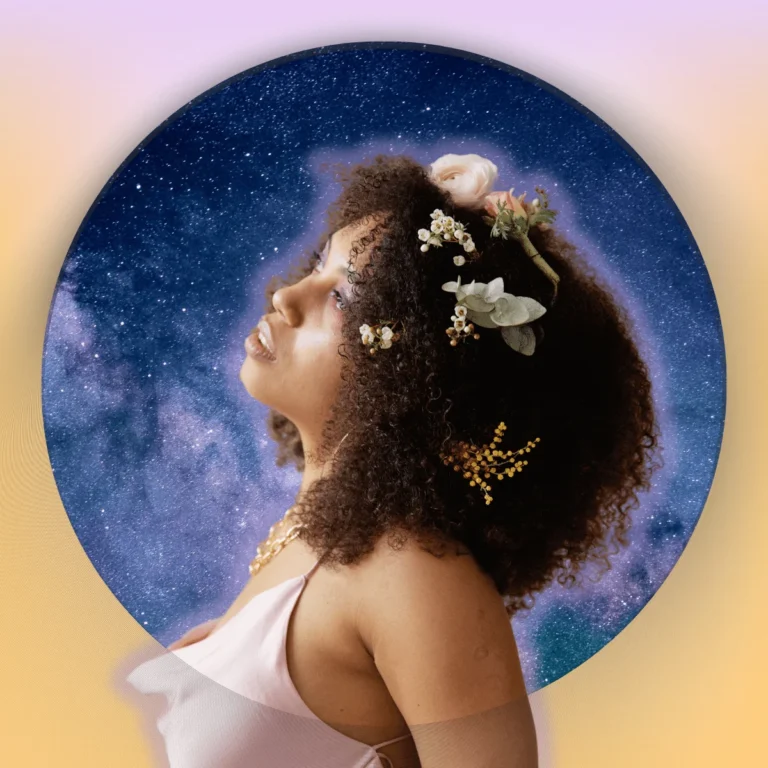 Side view of woman with flowers in her curly hair .Thumbnail