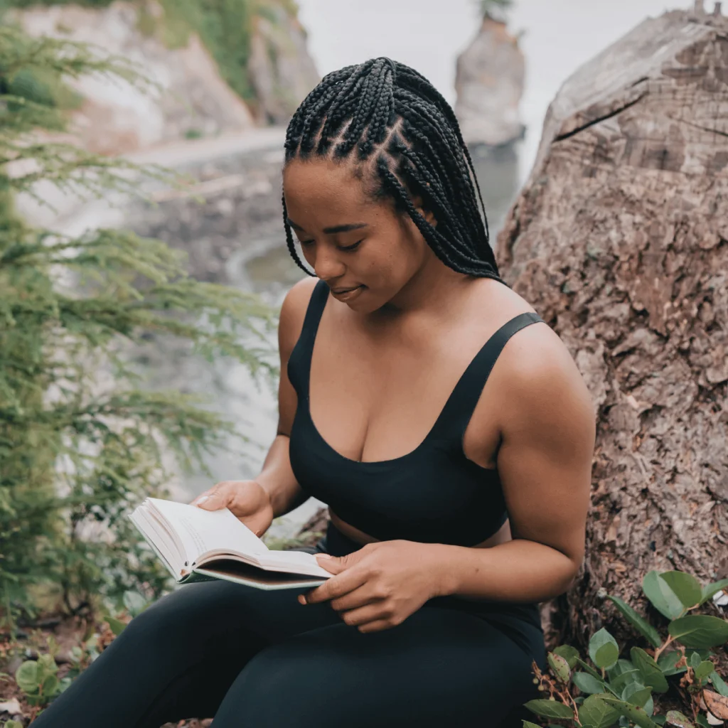 Woman in Black Tank Top Reading Book. Positive Affirmations For Self-Confidence