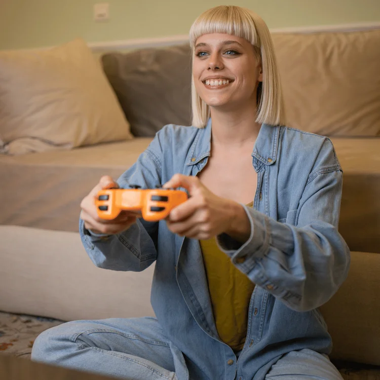 Woman playing video games. Saturday selfcare ideas