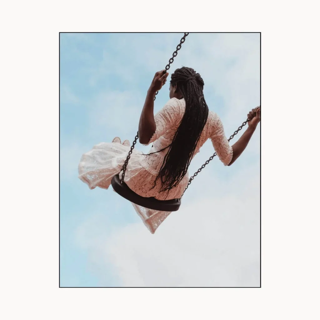 Woman swinging on a swing.