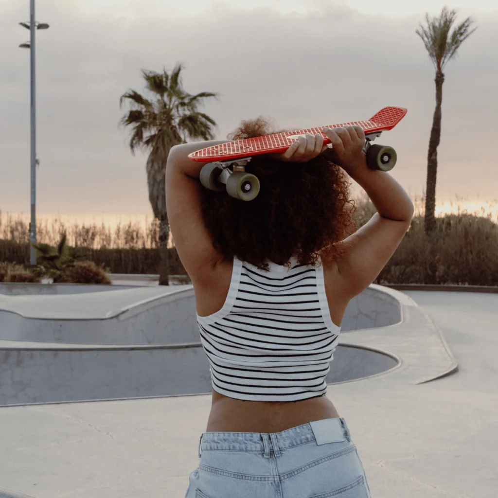 Young-woman-with-red-skateboard-in-a-skatepark.-100-Solo-Date-Ideas